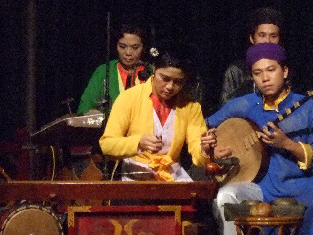 The Dan Bow player at the water puppet show