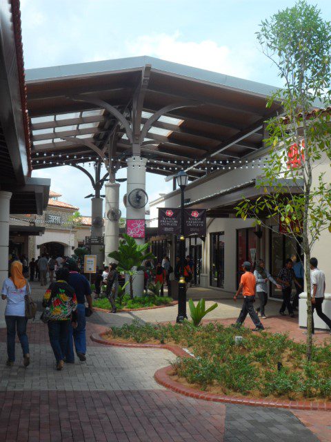 Not many people carrying shopping bags from Johor Premium Outlets stores