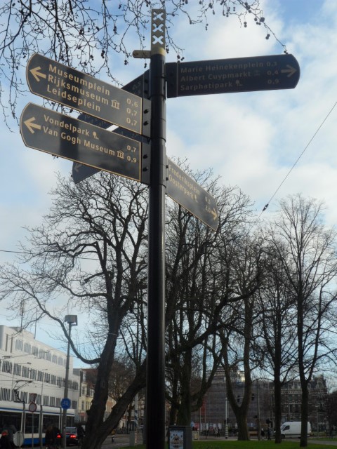 Directional signs pointing to Albert Cuypmarkt Amsterdam