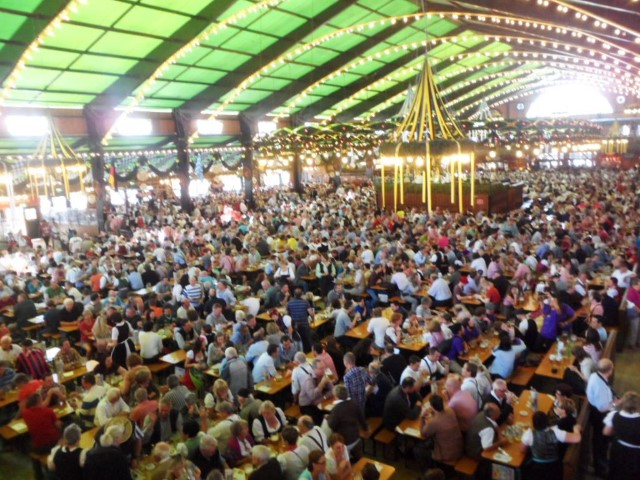 Throngs of people in the Oktoberfest beer tents - in the middle of the day!