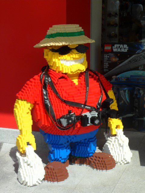 Tourist with bags of goodies coming out of The Big Shop at Legoland Malaysia