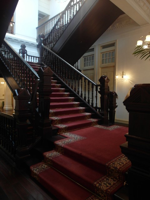 Lavish stairs of main lobby Raffles Hotel