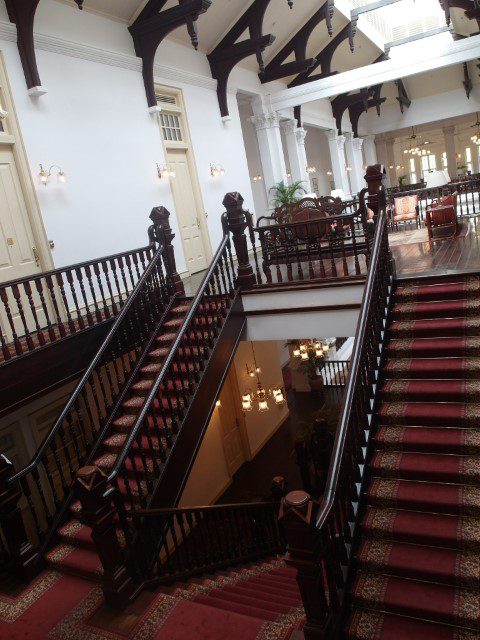 Natural sunlight brightens the lobby of the Raffles Hotel