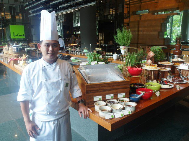 Chef Alex striking a pose at the entrance of Lime Restaurant, Parkroyal on Pickering