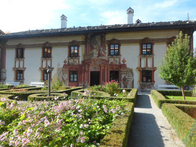 House with mural art and a nice garden