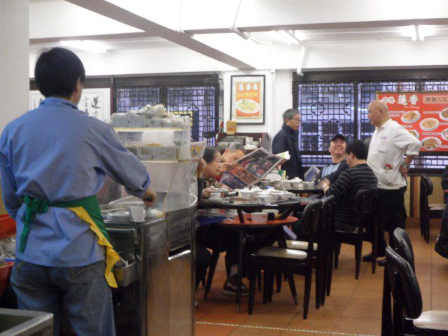 Aunty frying turnip cakes and other cakes in this make shift fryer in Lian Xiang Ju