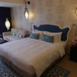 Elegant blue and inviting bed of Club Room Village Hotel Katong
