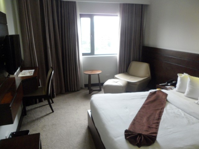 Huge bed in Deluxe room of Castle Peak Hotel