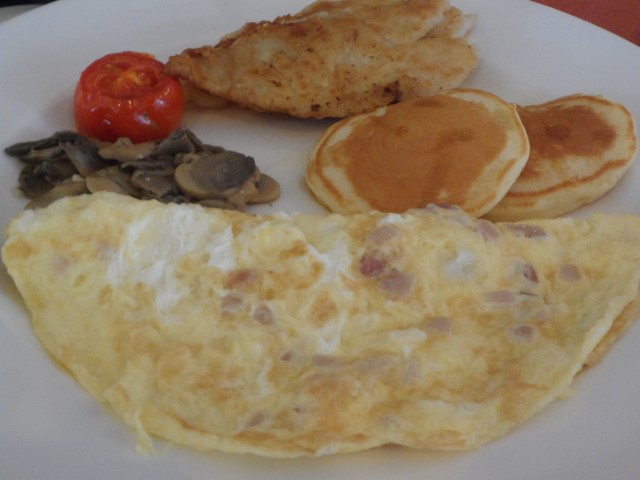 Peacock Garden Breakfast Salty cream dory with tomato, mushrooms, ham and cheese omelette and pancake