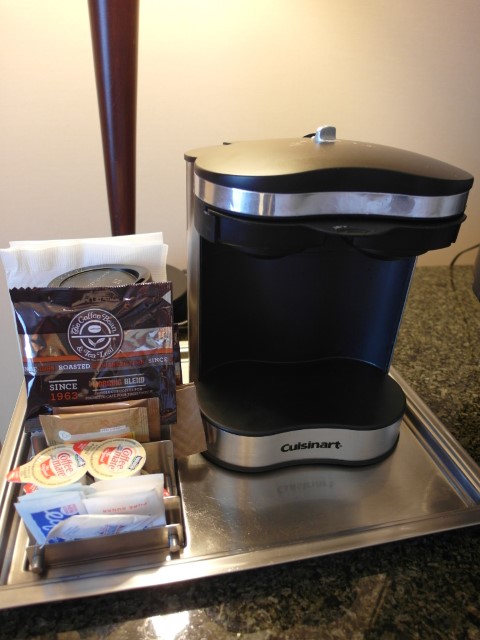 Coffee machine with coffee bean powder Hilton Vancouver