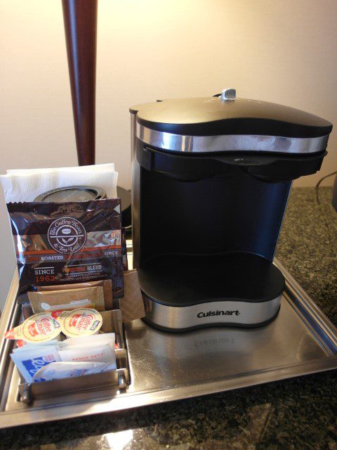 Coffee machine with coffee bean powder Hilton Vancouver