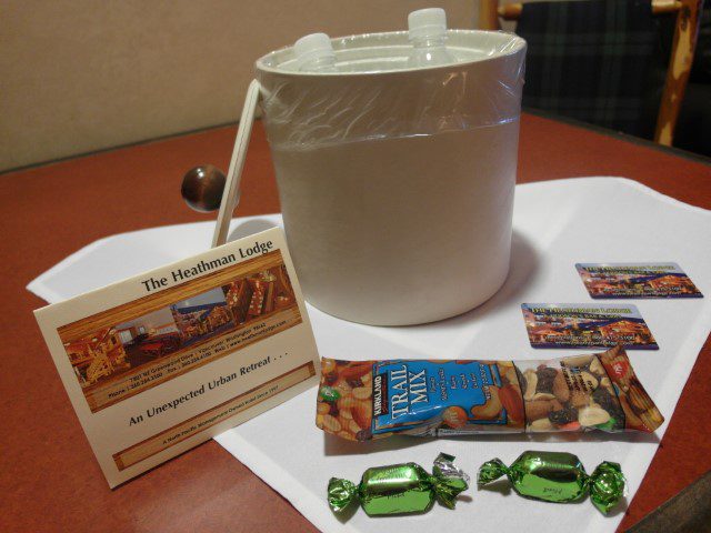 Ice chilled water, snacks and welcome note at the deluxe suite of Heathman Lodge