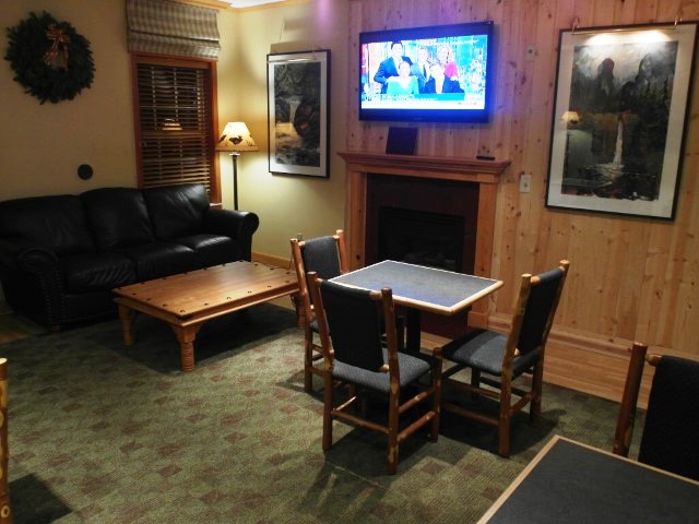 TV area during evening reception at hospitality suite of Heathman Lodge