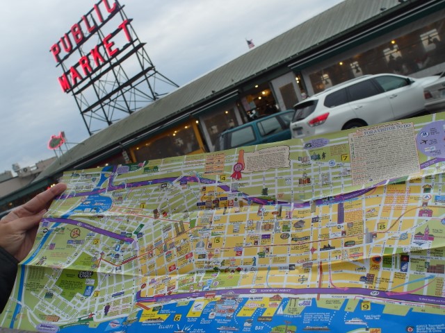 Map of Seattle with Pike Place Market in the background