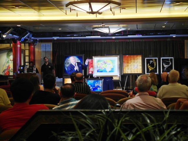 Tom, the Art Director from Art on Royal, during a Champagne Art Auction on Royal Caribbean Cruise