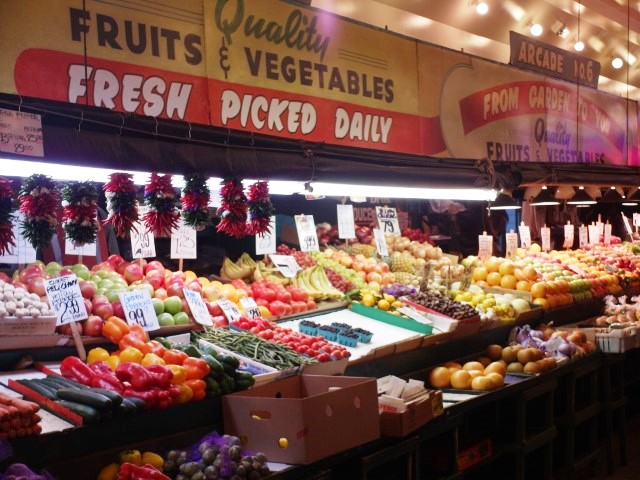 Fresh produce of brightly coloured fruits and vegetables at Pike Place Market Seattle