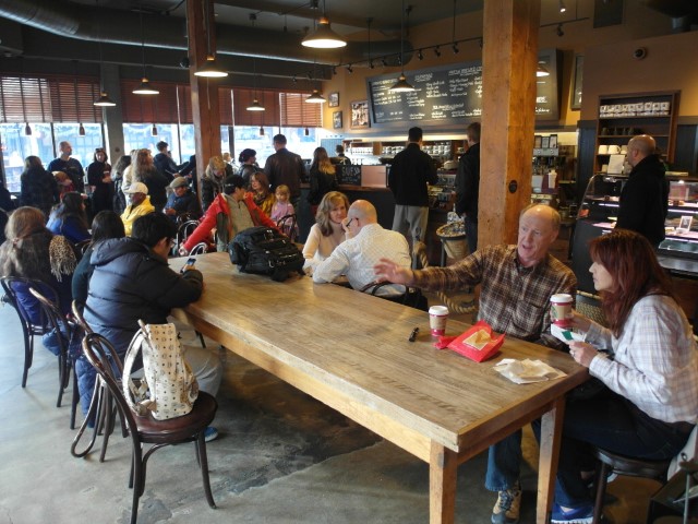 Crowded Starbucks adjacent to Seattle's Pike Place Market