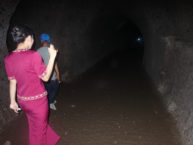 Entrance into the caves - Intan continues to translate what the local guide says about the caves