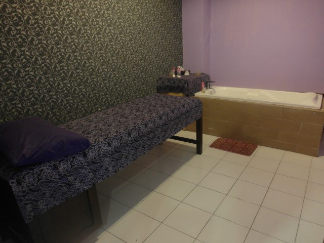 Massage area with bath tub