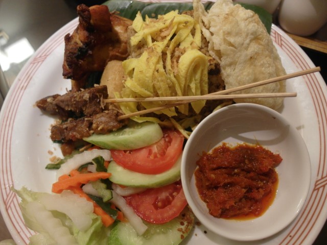 Nasi Goreng Kampung - fried rice with an assortment of small dishes in it