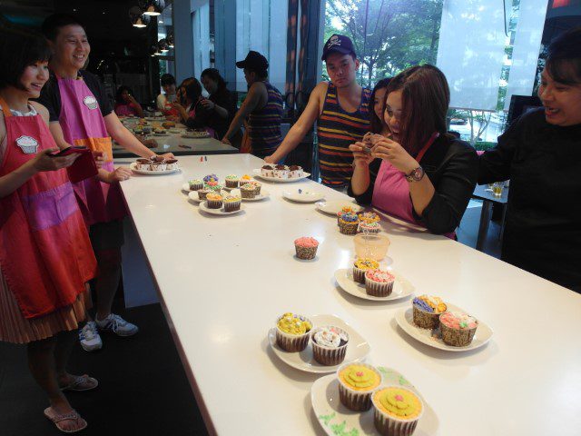 Taking photos of the beautifully decorated cupcakes