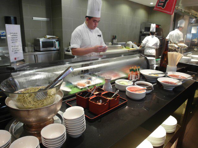 Japanese corner with salmon sashimi and fresh oysters