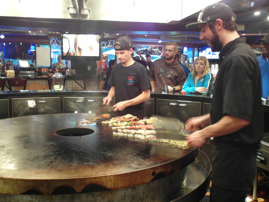 The master chefs at work on a grill similar to the mongolian grill / Teppanyaki concept