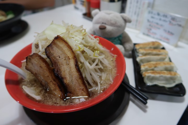LL Pork Ramen from Akamaru Ramen Shop Okinawa with a small plate of gyoza