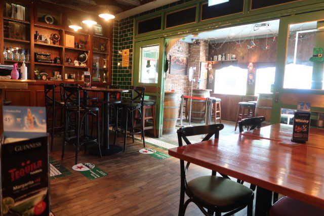 Oak barrels used as tables at The Drunken Poet