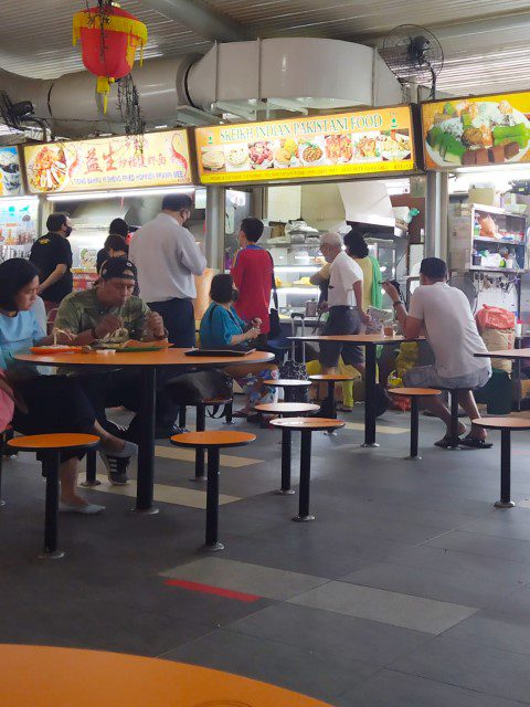 Uncle Toh (Yi Sheng Fried Hokkien Prawn Mee) heading back after buying chopsticks for takeaway customers