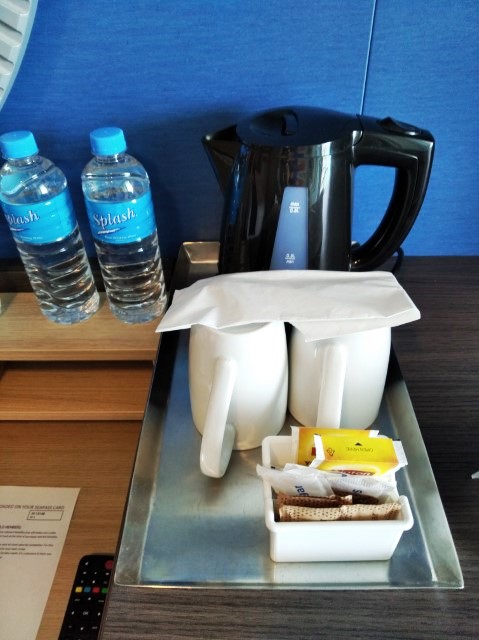 2 bottles of water and coffee/tea amenities in balcony class state room Quantum of the Seas