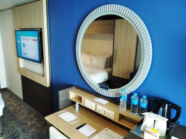 TV, water, power outlets in balcony state room of Quantum of the Seas