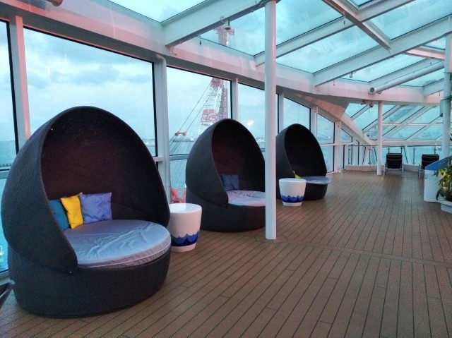 Comfortable lounge chairs in Solarium of Quantum of the Seas