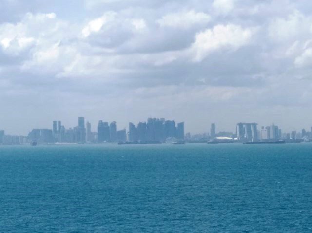 Close up view of the Singapore Skyline (MBS, Singapore Flyer) as seen from Quantum of the Seas Balcony State Room