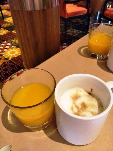 Freshly squeezed orange and latte at Main Dining Room Quantum of the Seas