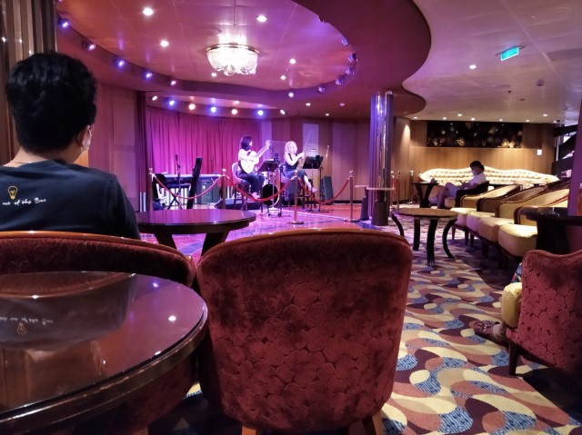 Attending a second session of performance by Accolade Duo on the last full day of cruise to nowhere