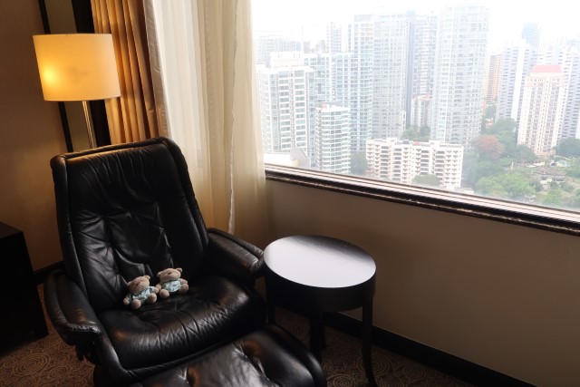 Mandarin Orchard Singapore Staycation Family Suite Leather Recliner Chair with a view of Orchard Road