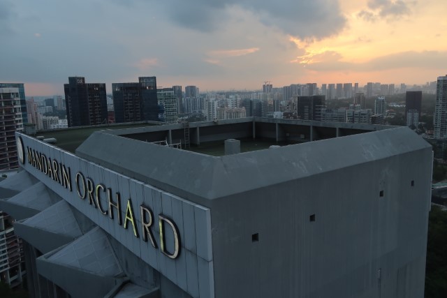 Sunset from Meritus Club Lounge with view of Main Tower of Mandarin Orchard