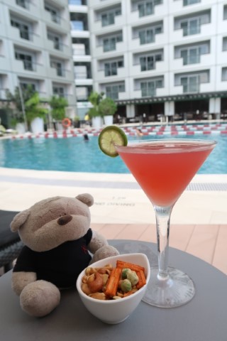 Seabreeze Cosmopolitan and snacks from pool bar of Fairmont Singapore