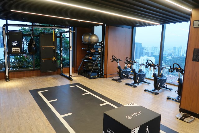The Clan Hotel Sky Gym with workout space and movie-sized screen for work out videos