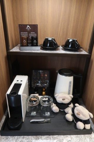 In-room amenities and coffee/tea facilities at The Clan Hotel