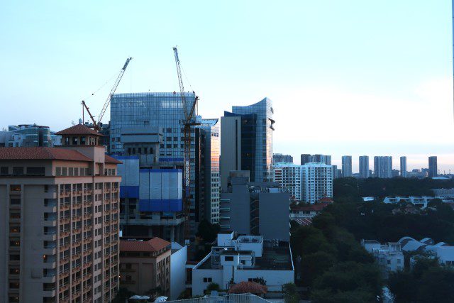 Sunset colours reflecting off the buildings next to Orchard Hotel