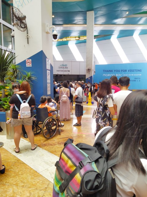 Queuing to enter the Marina Bay Cruise centre after receiving the all clear for ART test for Genting Cruise to Nowhere