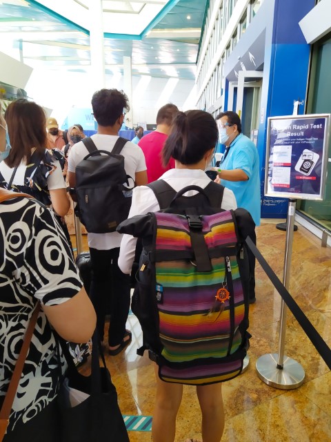 Getting your passport and negative ART result ready before entry to Marina Bay Cruise Centre