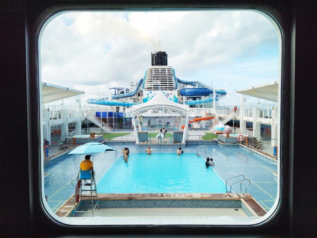 Window that framed the swimming pool at Deck 17 of Genting World Dream