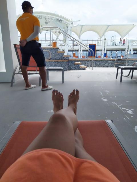 Chilling out at swimming pool on Genting World Dream Cruise to Nowhere