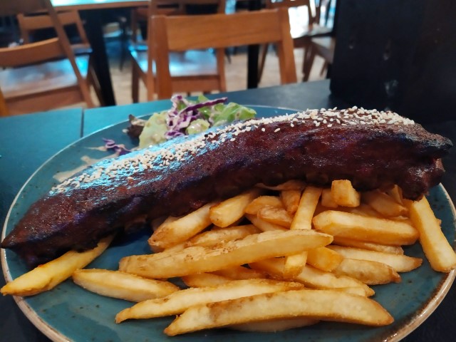 A large slab of Char Grilled Baby Back Ribs from Viva Loca @ Changi City Point