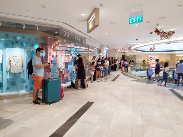 Crowds forming at 11pm for ART testing at Raffles City for Royal Caribbean Cruise to Nowhere