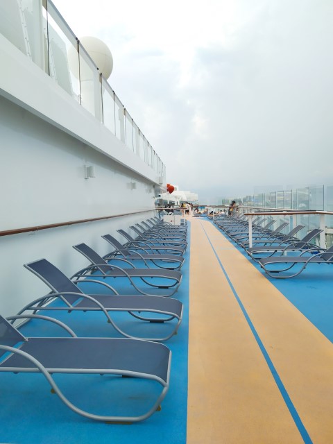 Rows of deck chairs on Spectrum of the Seas