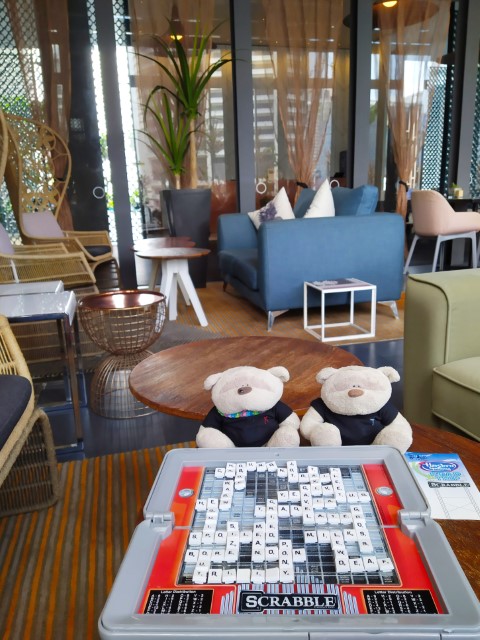 Playing Scrabble at Oasia Downtown Club Floor